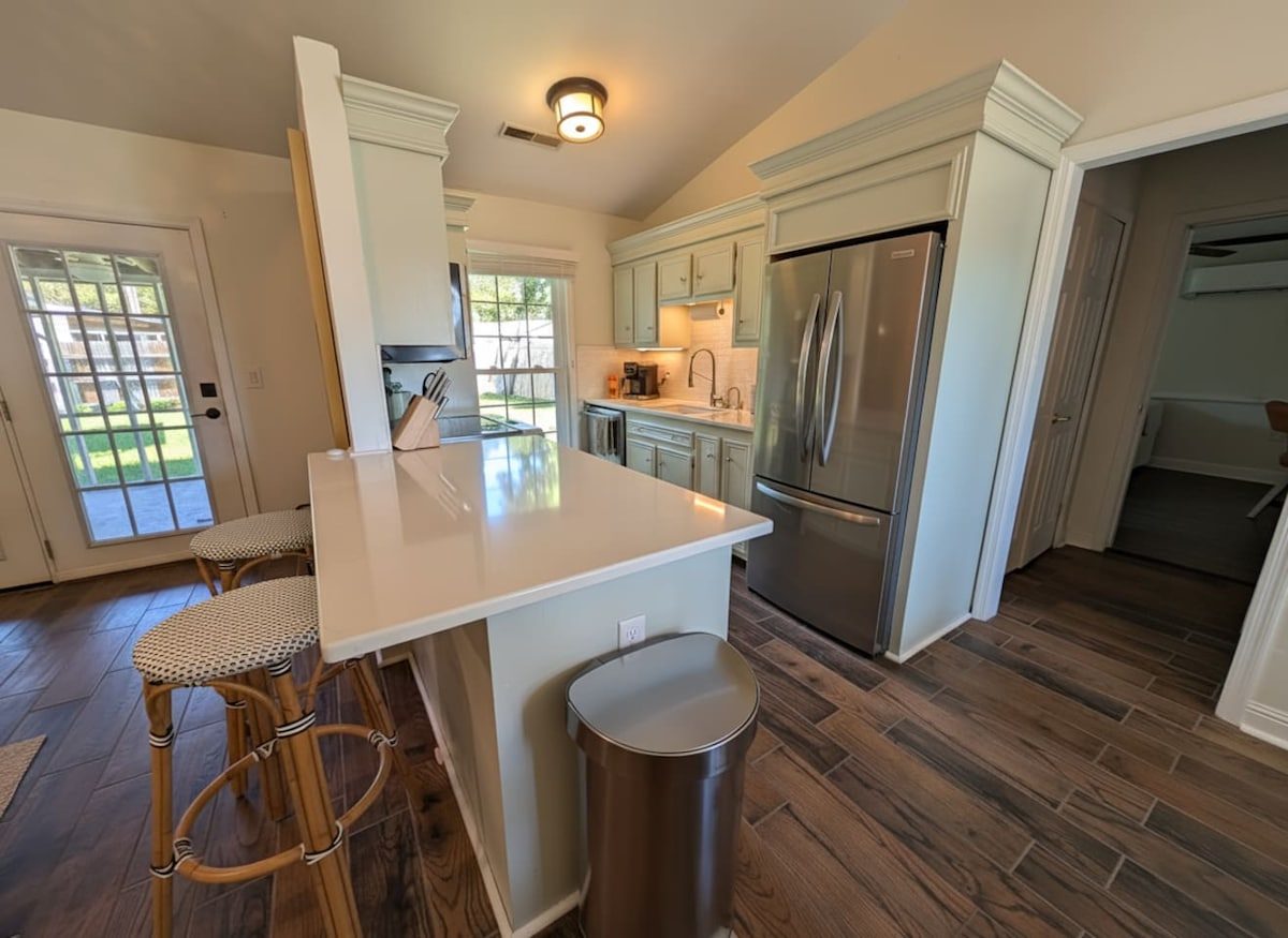 Full kitchen, island seating for three.