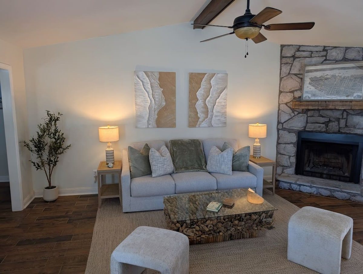 The living room, stone hearth and vaulted ceiling.